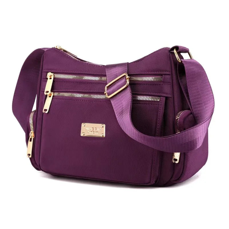 Women's handbag in various colors, multi-layered with zippers, can be worn diagonally or carried on the shoulder.
