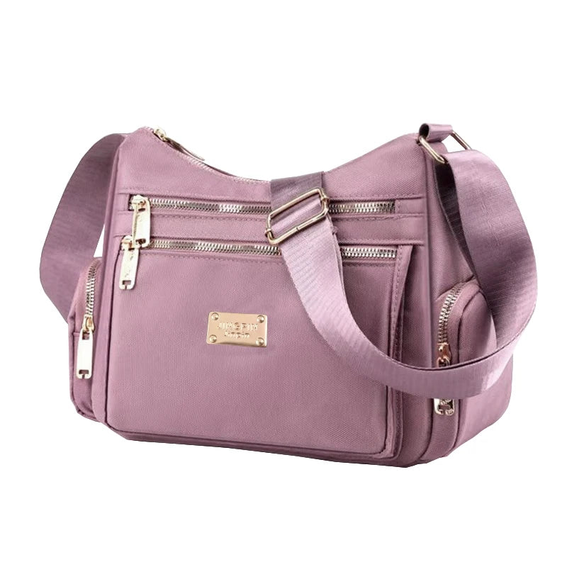 Women's handbag in various colors, multi-layered with zippers, can be worn diagonally or carried on the shoulder.